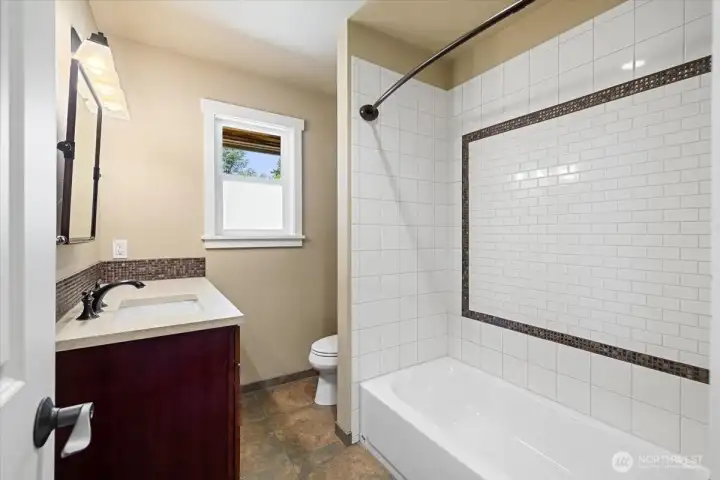 Full bathroom across from the secondary bedroom.