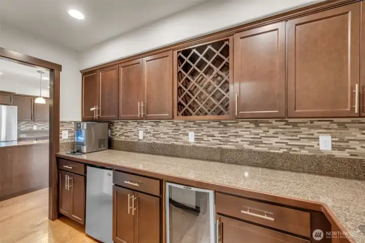 Butler pantry with under counter fridge and wine cooler