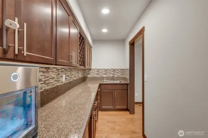 Butler pantry has a wet bar.