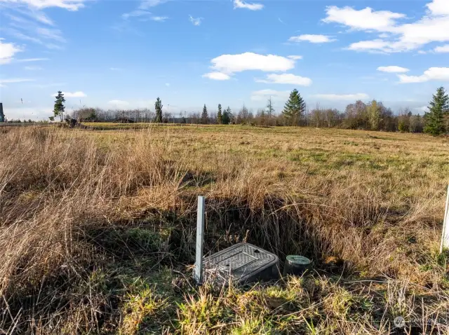 Water fee is paid for. Water and power on the corner of the property.