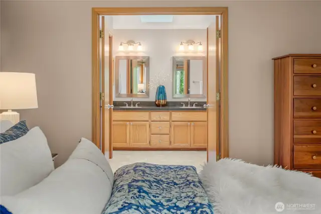 The primary bath is adjacent to the bedroom.
