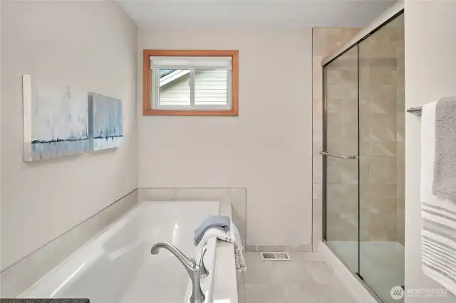 Soaking bathtub and a walk-in shower.