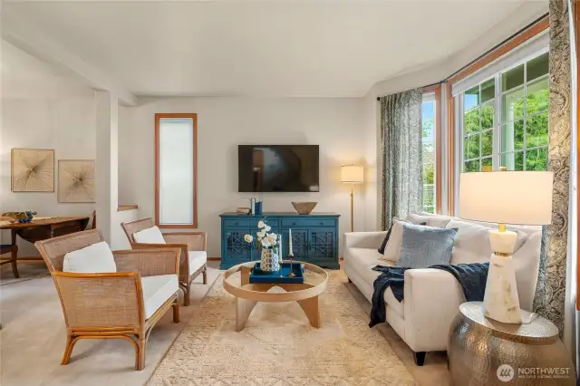 Here is the formal living room- the large picture windows overlook the gorgeous garden in the front yard.