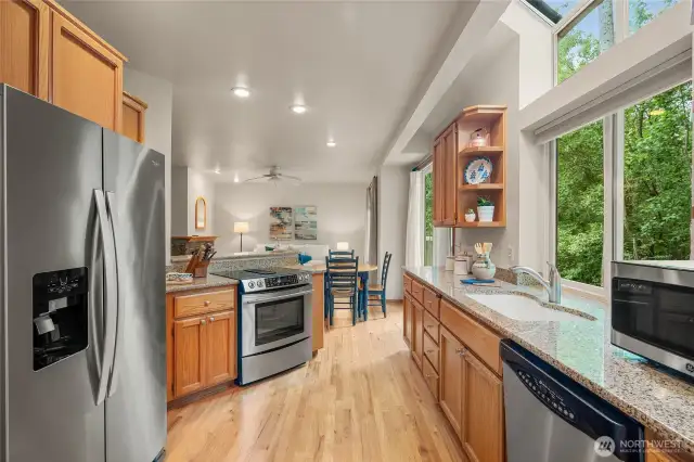 Kitchen is light, bright and very functional. Kitchen sink window looks out to tranquil green space.