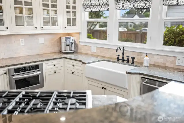 The flow of the kitchen has functionality in mind. The small details like the farmhouse sink, The solid single piece granite counters, the mullion cabinet doors.