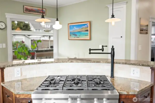 Enjoy a view of your beautiful outdoor space while cooking in the kitchen. Enjoy a conversation with guests while enjoying an elevated chefs kitchen.