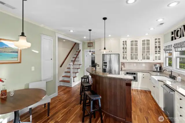 Anywhere you stand in this home you can notice all of the high end finish work. The millwork, flooring, kitchen, stairs and the small timeless details like the original pocket door and built in