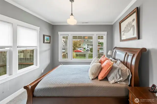 The front bedroom is used as the primary bedroom. A room surrounded by windows but also with privacy in mind. The laminated and sound transmission control window package keeps you looking out but not easy to look in.