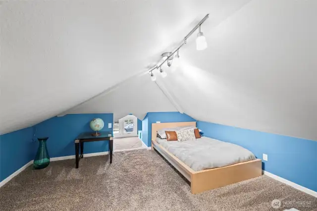 With minimal space this area was finished nicely with a small and quaint reading knook. This space is perfect for the grandkids or younger children...heck even an adult could use this as their own private loft.
