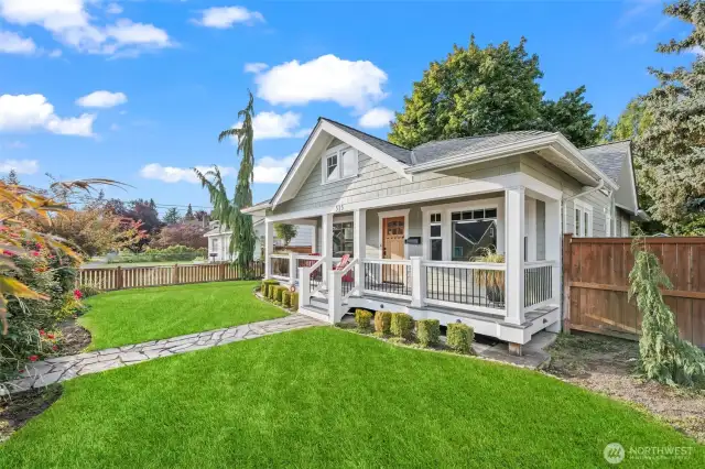 Covered front deck to enjoy the weather and all the activity of downtown. The fully fenced front yard has a partion fence in the front to enjoy the view while maintaining a bit of privacy.