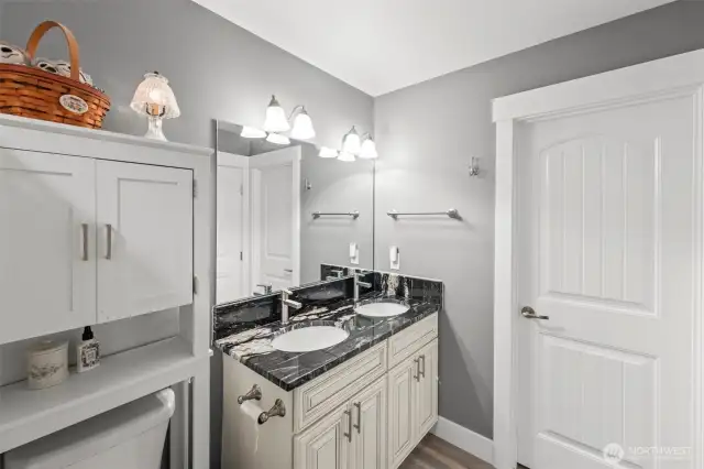 Double sinks with marble counters in primary en-suite