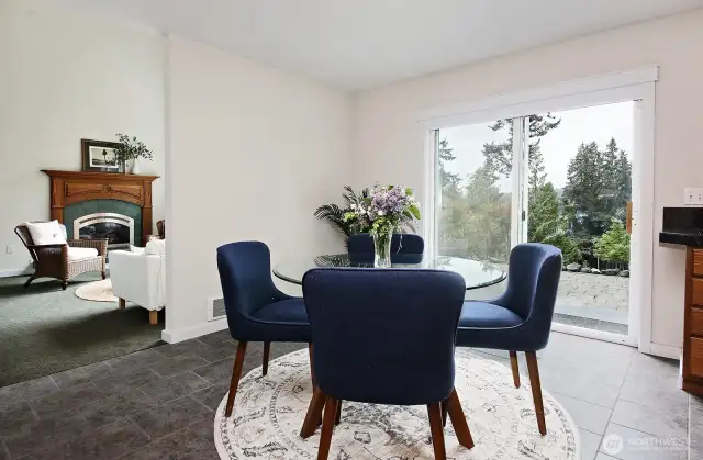 Dining area within the kitchen. Ceramic tiled floors. Great flow to the outdoors with the sliding glass doors. Plenty of space for entertaining in this home.