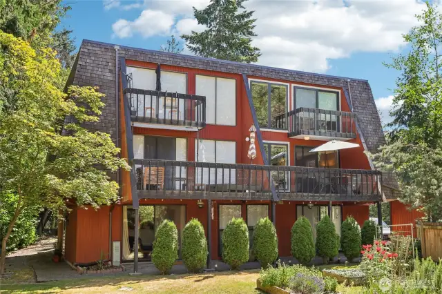 Two level condo overlooking community pool and gardens