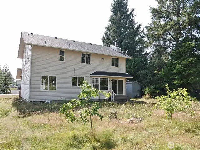 Rear of the home and backyard.