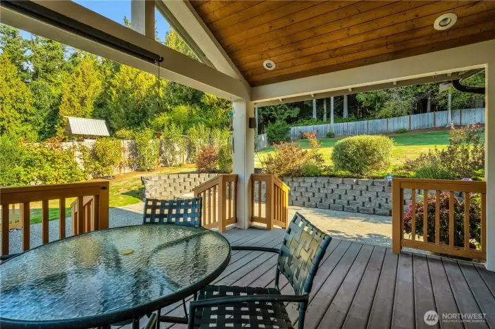 Relax or entertain on the spacious covered deck overlooking a beautifully landscaped backyard. Enjoy peaceful views, mature trees, and a private setting perfect for outdoor dining or morning coffee.