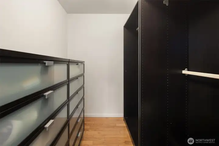 Walk-in closet in primary suite.