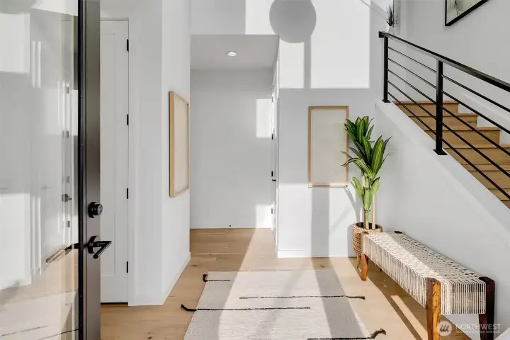 Spacious entry way with coat closet.