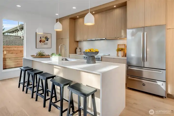 Massive island opens to the dining area.