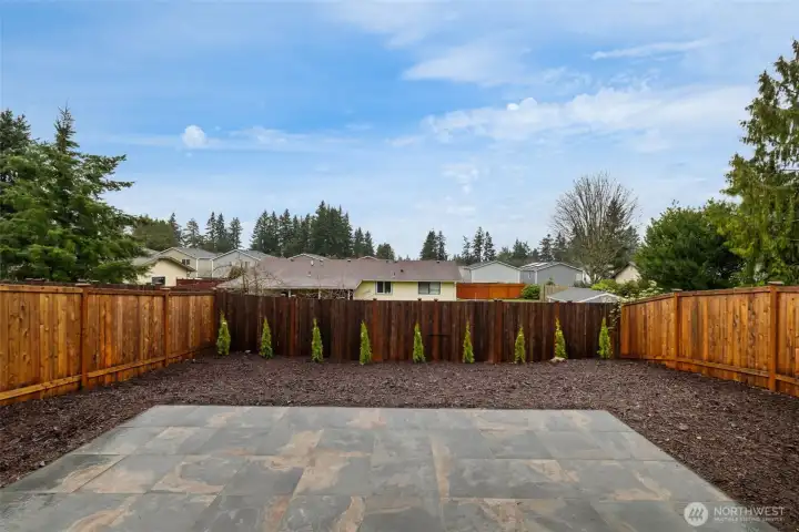 Spacious patio for dining and lounging.