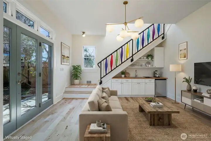 VIRTUALLY STAGED- Wanted to show how this space was set up before. It had a cabinet with a fridge and a few small kitchen things. You could make the back space into a 3rd rental and have a tri-plex! It has its own entrance.