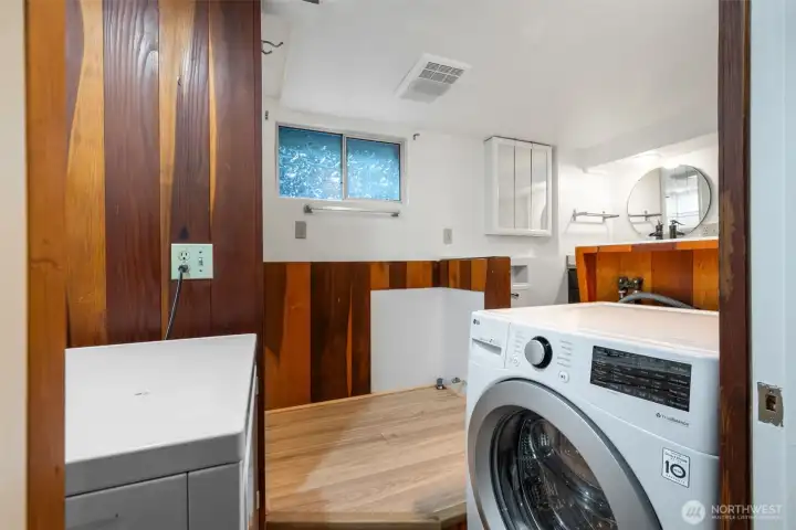 Bathroom on the lower level with tub, shower and its own laundry.