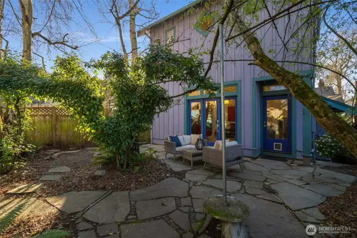 A large kiwi tree covers that back area and gives lots of shade.