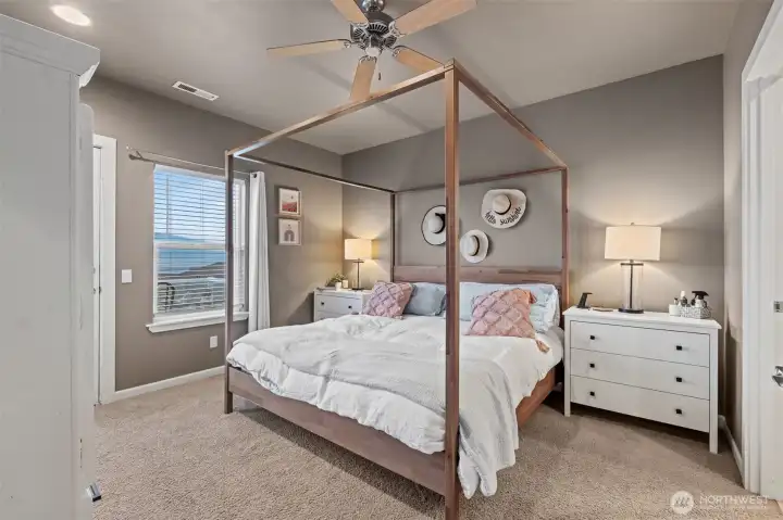 Generous primary fits king size bed, large nightstands and a dresser.