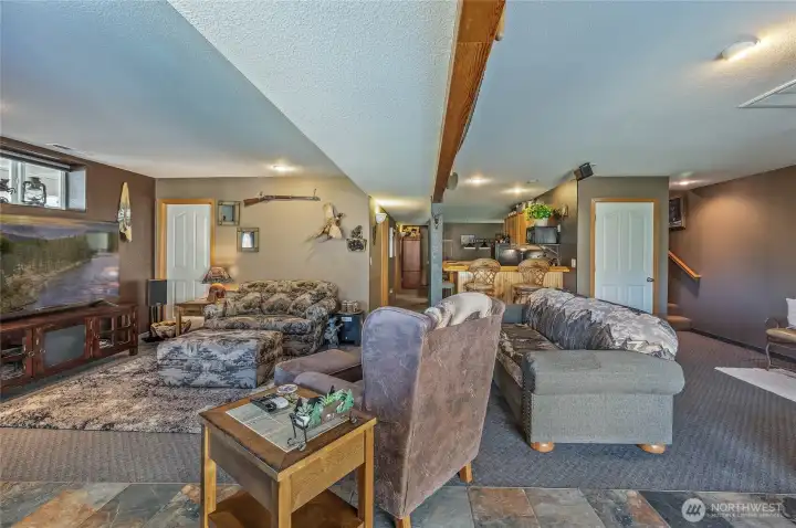 Entertainment room leading to bar/kitchen and billiards room