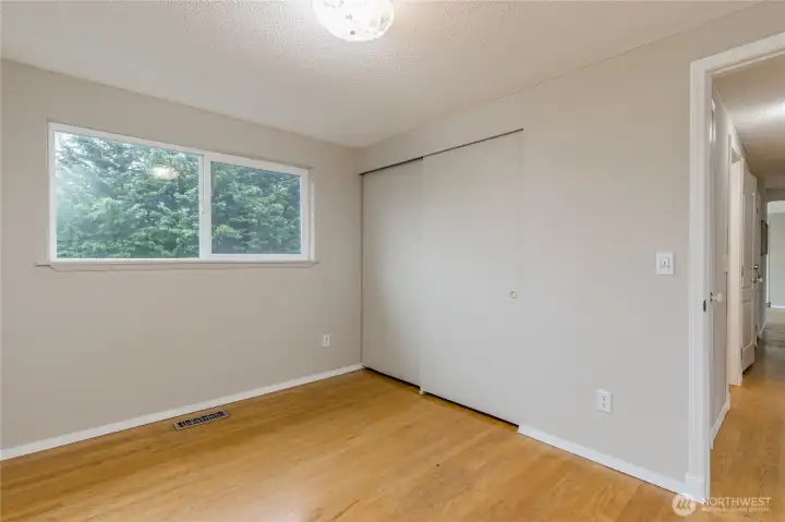 Primary bedroom at the end of the hallway