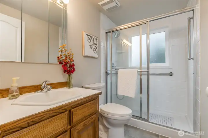 Main level 3/4 bath with a new tiled shower