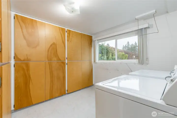 Generous laundry room with tons of storage