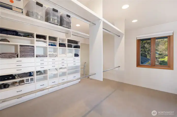 Spacious custom walk-in closet with built-in organization, offering both functionality and refined storage for everyday living.