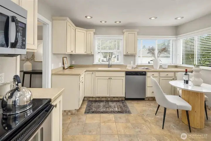 The kitchen is sunny and well equipped with ample counter and storage space.