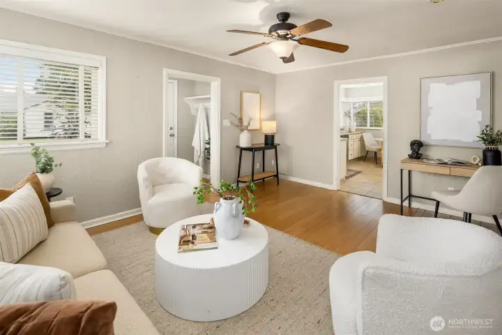 Back in the living room looking to the front door and its alcove perfect for hanging coats and keys.