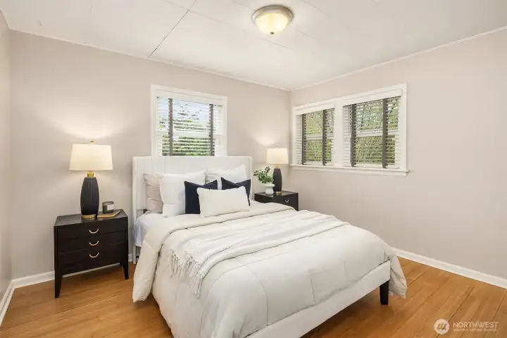 A sunny room with a fresh vibe and charming plantation shutters.