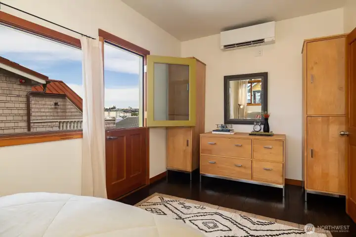 Built-in dresser and armoire & door to the second floor deck!
