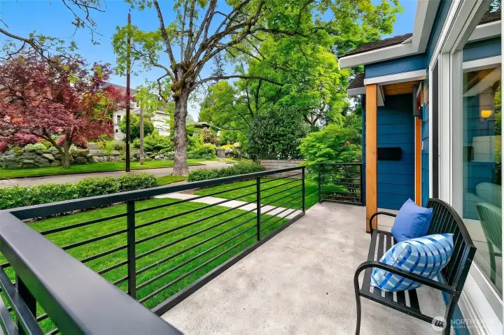 New porch and 2 big oak trees in the front yard.