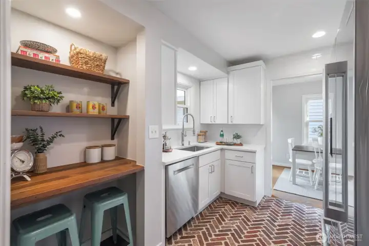 Reclaimed Douglas fir wood shelves add interest, usability and display in this perfect kitchen.