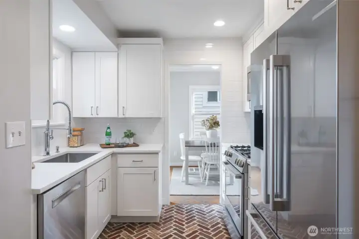 Light fills this home from every room. Kitchen is well designed and includes custom details.