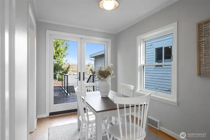 Dining room with new French doors lead to the new, very private entertainment deck.