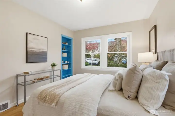 One of two bedrooms on the main with west facing light and usable, sweet built in shelves.