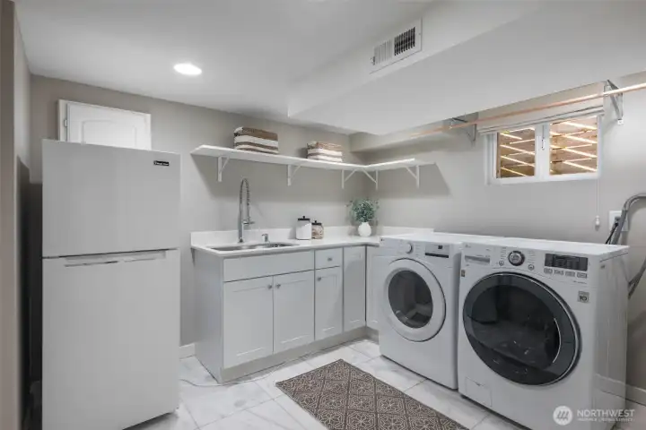 Huge laundry / utility room with new washer & dryer, utility sink and 2nd refrigerator.