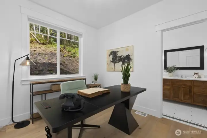 Flexible main floor bedroom or den with a ¾ bath ensuite.