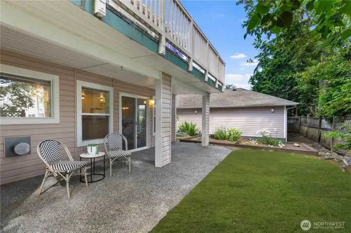 expansive covered patio with yard space and garden area!