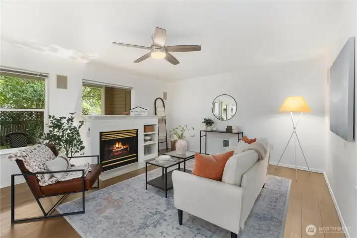 living room with fireplace and large windows