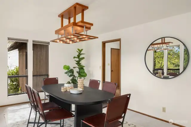 The dining room is centrally located between the kitchen and living room.