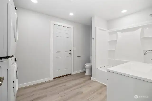Upstairs full bath with laundry. New applinaces, cabinets, electric and plumbing fixtures