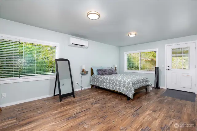 Primary bedroom with private outside deck and has AC