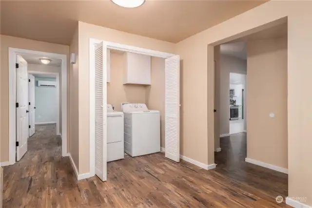 Laundry area and hallway that takes you to the kitchen