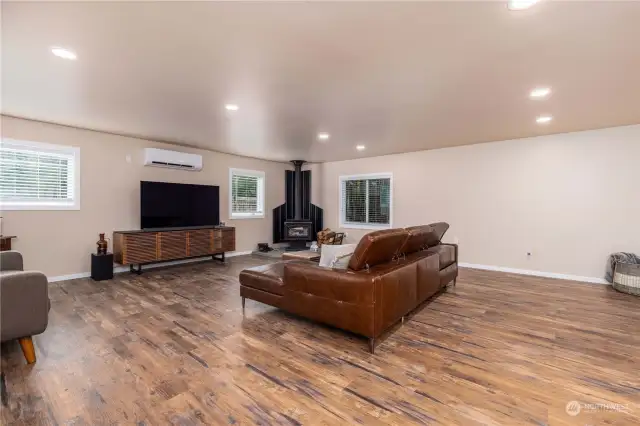 Another angle of the family room with AC and wood stove